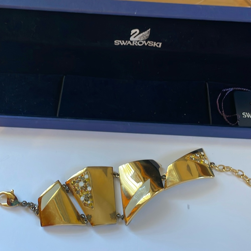 New in the box Swarovski bracelet stones  gold enamel